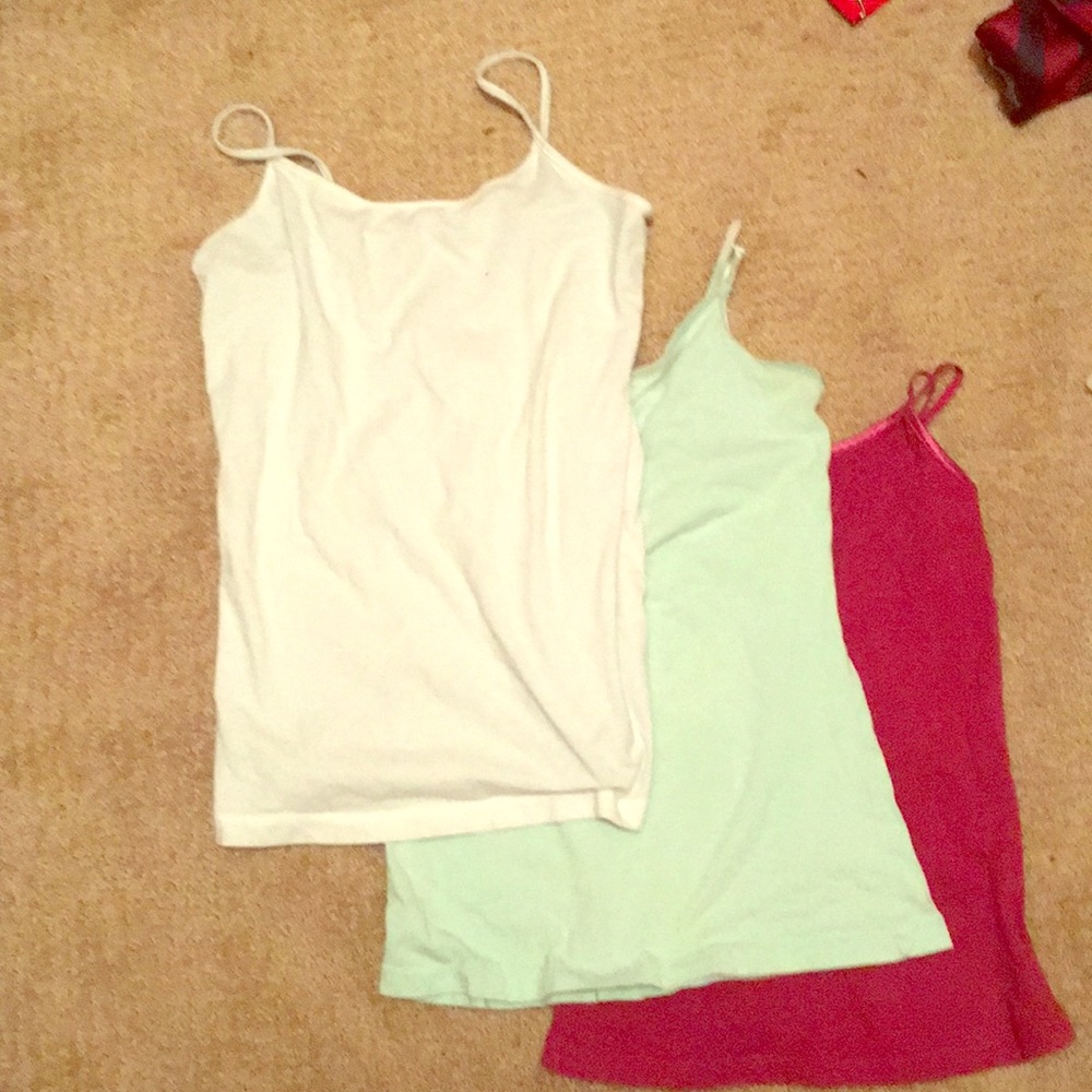 Three tank tops (White,Blue,Red,Black)